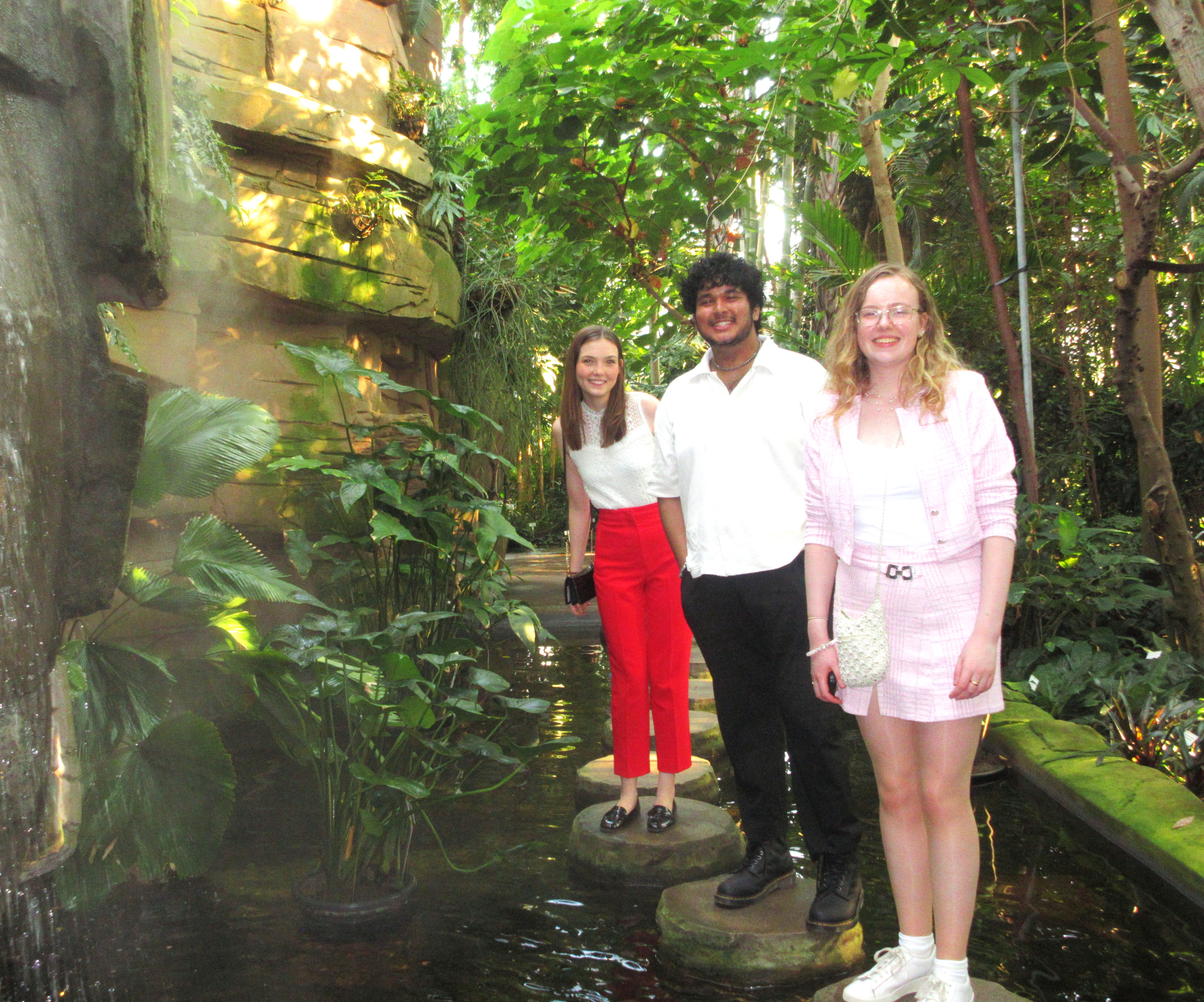 3 students in a botanical garden.